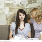 Woman comforting friend